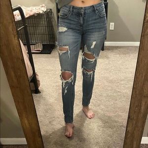 Distressed skinny denim; mid-rise